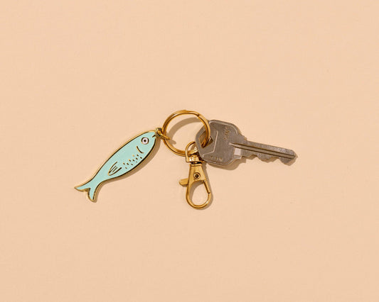 And Here We Are - Enamel Keychain & Bag Charm—Sardine (Tin Fish, Foodie Gift) - PMA Store at the Portland Museum of Art, Maine