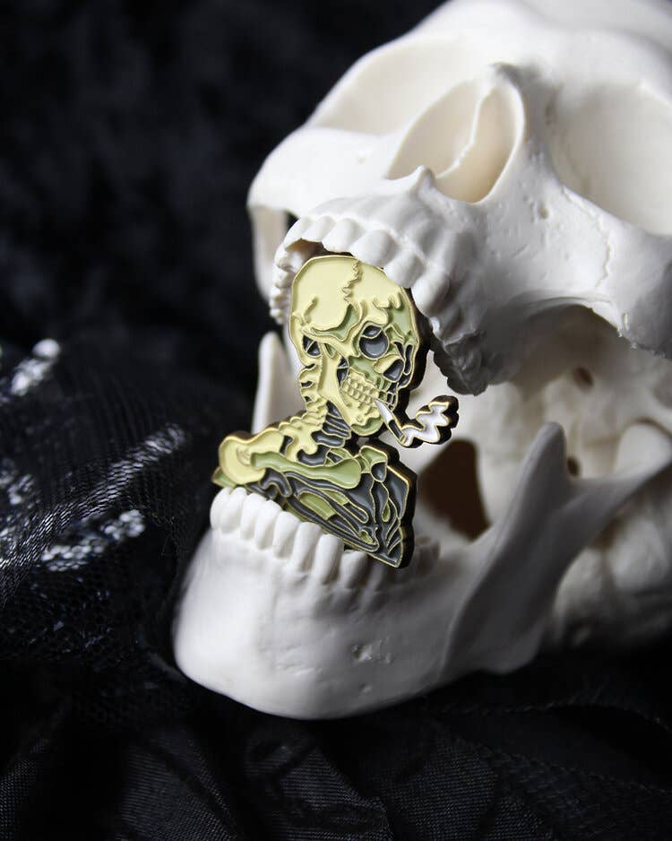 Skull of a Skeleton with Burning Cigarette • Enamel Pin - PMA Store at the Portland Museum of Art, Maine