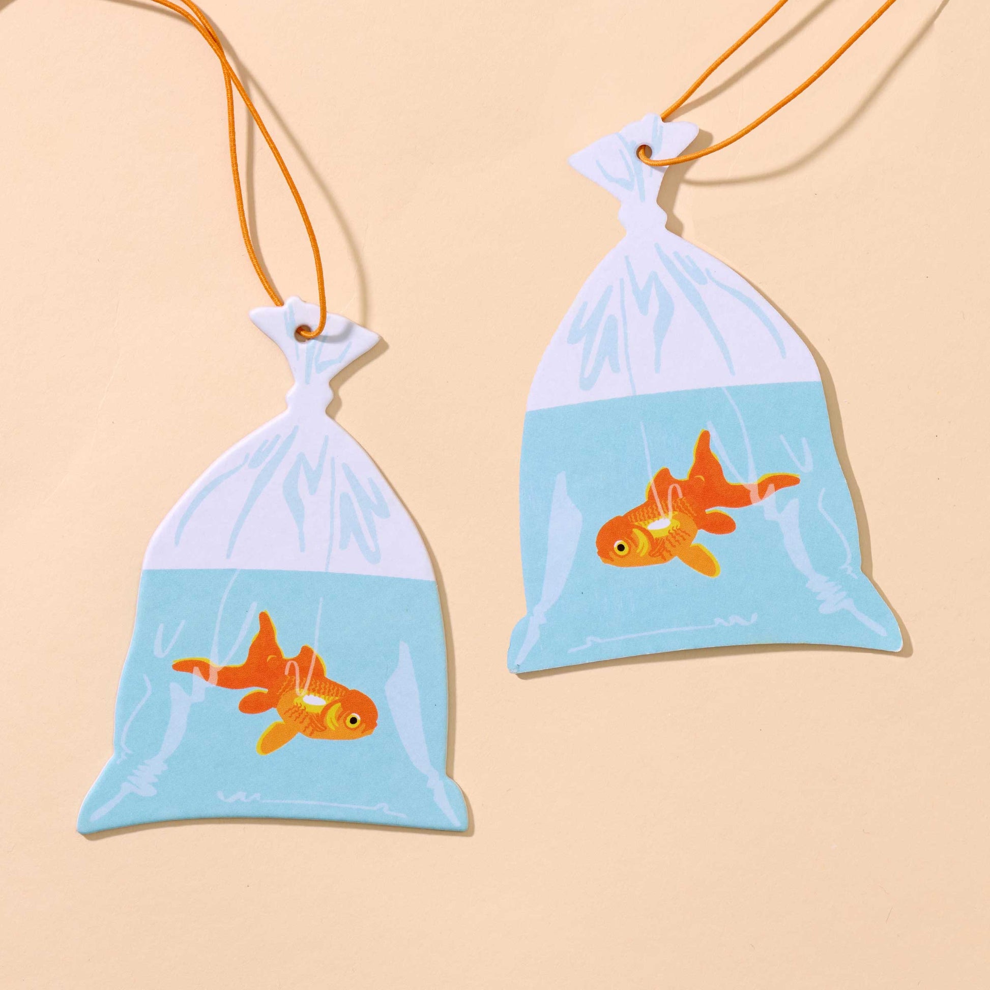 And Here We Are - Air Freshener—Goldfish in Bag—Rain Scent (Circus, Fun Gift) - PMA Store at the Portland Museum of Art, Maine